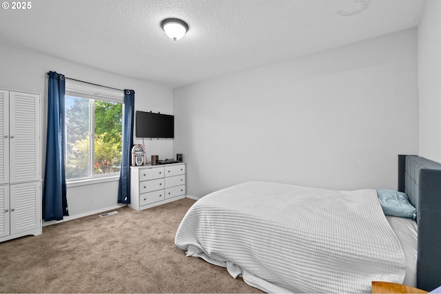 42015 NW Buckshire St, Banks, OR 97106 - bedroom featuring visible vents, a textured ceiling, baseboards, and light carpet