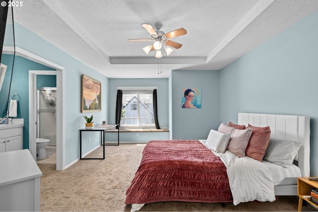 42015 NW Buckshire St, Banks, OR 97106 - bedroom featuring a textured ceiling, light carpet, a raised ceiling, and ensuite bath