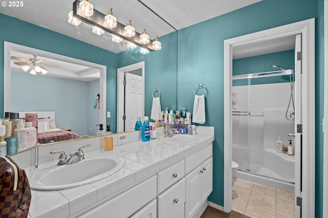 42015 NW Buckshire St, Banks, OR 97106 - full bathroom with double vanity, a sink, ceiling fan, and a stall shower