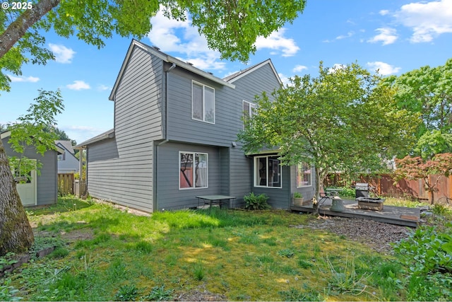 42015 NW Buckshire St, Banks, OR 97106 - rear view of house featuring a lawn, a wooden deck, and a fenced backyard