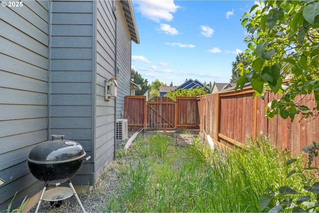 42015 NW Buckshire St, Banks, OR 97106 - view of yard with central AC, fence, and a gate