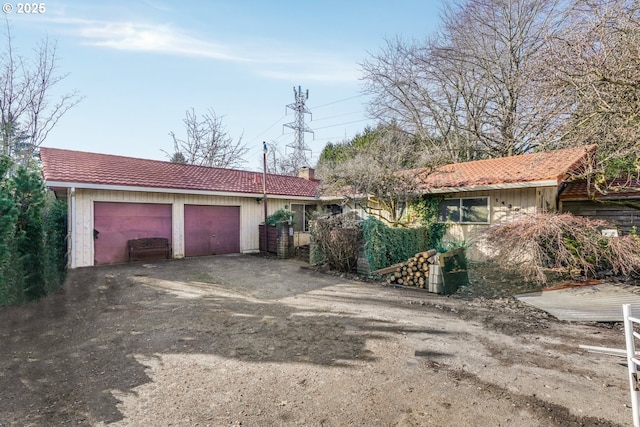 ranch-style house featuring a garage