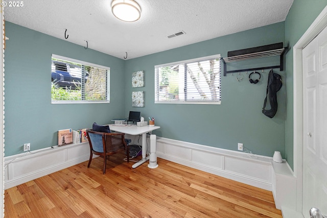 9333 SW 4th Ave, Portland, OR 97219 - office space featuring light wood-type flooring, a textured ceiling, plenty of natural light, and wainscoting