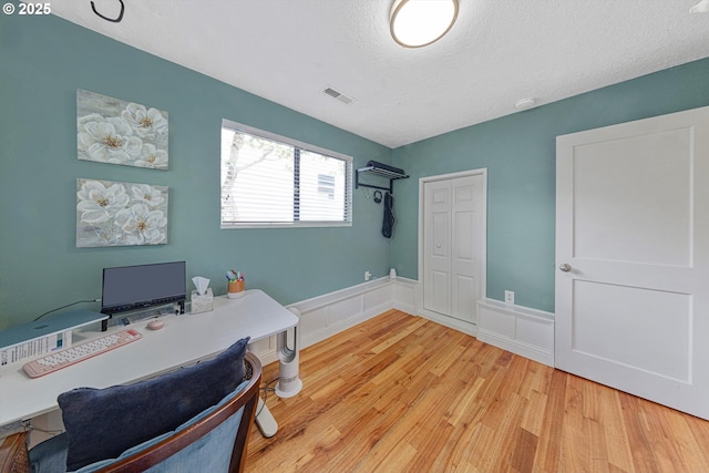 9333 SW 4th Ave, Portland, OR 97219 - office featuring wainscoting, light wood-type flooring, and a textured ceiling