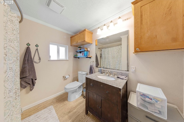 9333 SW 4th Ave, Portland, OR 97219 - full bathroom featuring toilet, crown molding, wood finished floors, vanity, and baseboards
