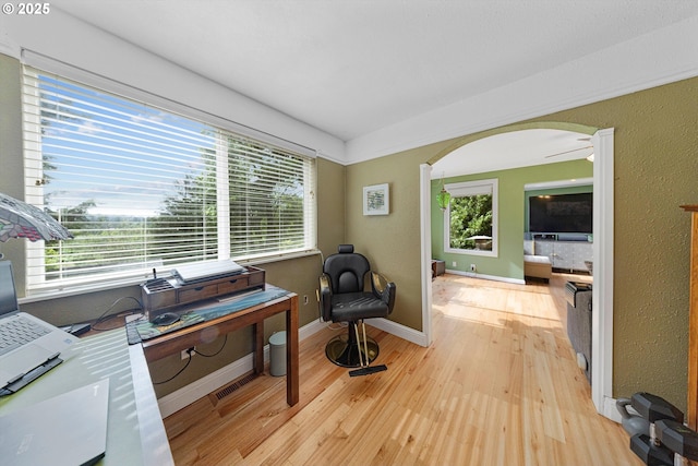 9333 SW 4th Ave, Portland, OR 97219 - sitting room with arched walkways, light wood-type flooring, and baseboards