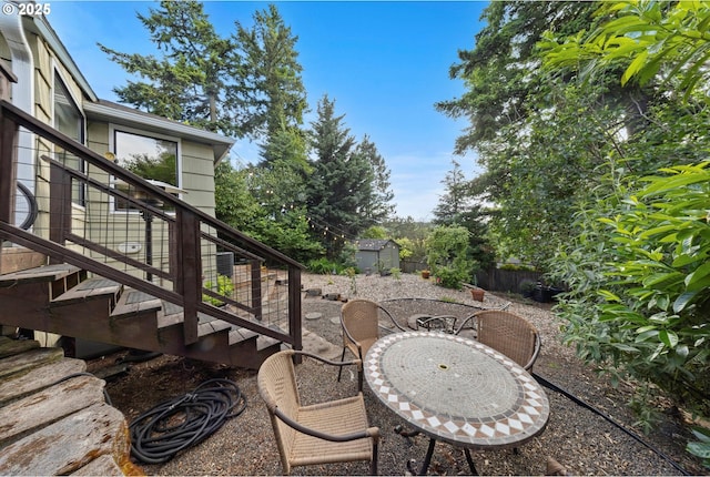 9333 SW 4th Ave, Portland, OR 97219 - view of patio featuring stairway and an outbuilding