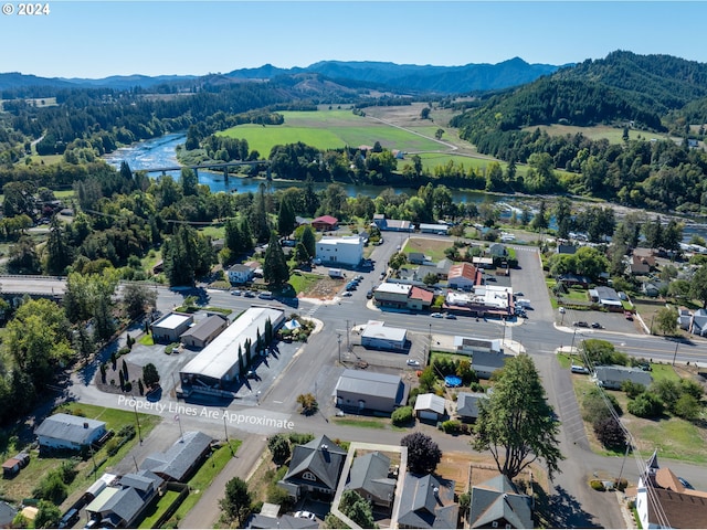 aerial view featuring a water and mountain view