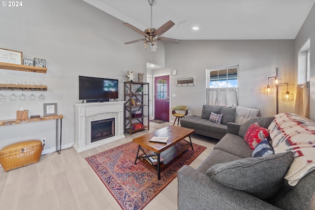 369 B St, Elkton, OR 97436 - living room with wood finished floors, ceiling fan, recessed lighting, a fireplace, and baseboards