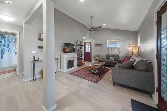 369 B St, Elkton, OR 97436 - living room with lofted ceiling, light wood-style flooring, a ceiling fan, a fireplace, and recessed lighting
