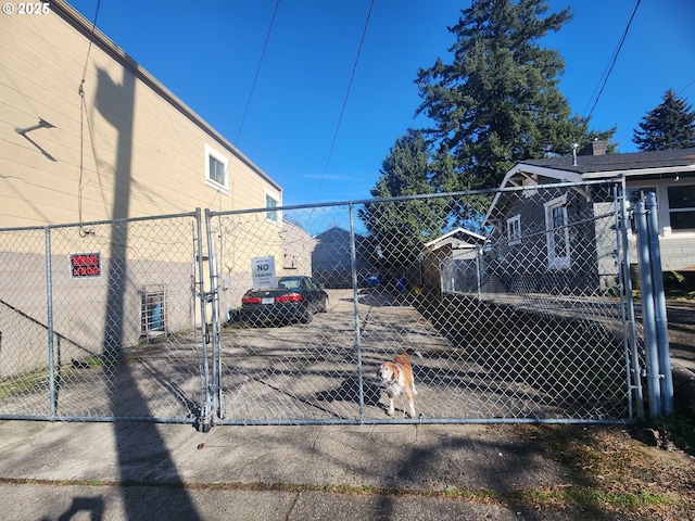 exterior space featuring fence and a gate