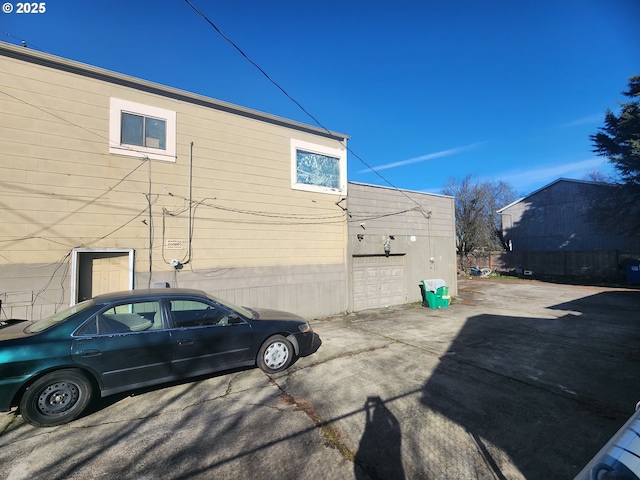 view of side of home with fence