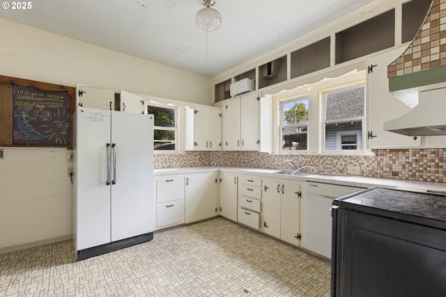3003 SE 58th Ave, Portland, OR 97206 - kitchen featuring freestanding refrigerator, light countertops, tasteful backsplash, and light flooring
