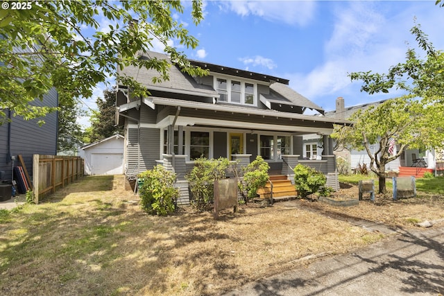 3003 SE 58th Ave, Portland, OR 97206 - view of front of home with a porch, an outbuilding, a shingled roof, and a garage