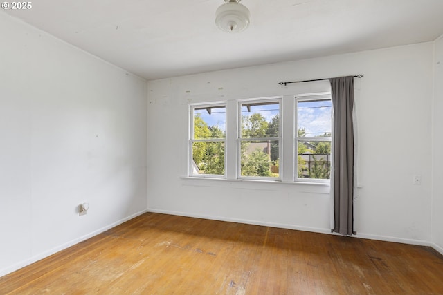 3003 SE 58th Ave, Portland, OR 97206 - unfurnished room featuring hardwood / wood-style floors and baseboards