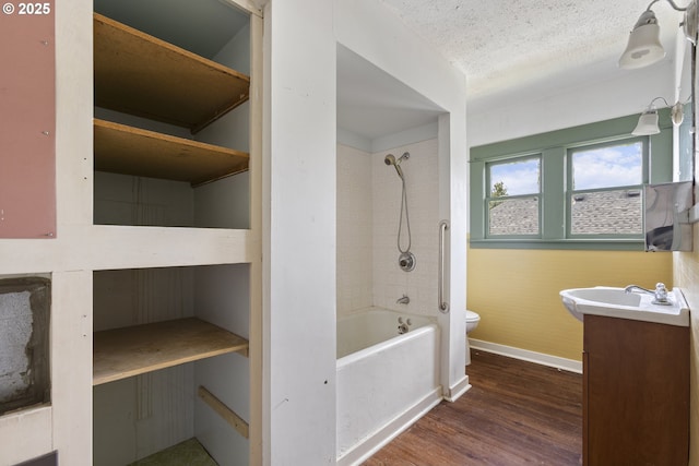 3003 SE 58th Ave, Portland, OR 97206 - full bath featuring vanity, wood finished floors, tub / shower combination, and a textured ceiling
