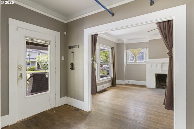 3003 SE 58th Ave, Portland, OR 97206 - foyer featuring crown molding, wood finished floors, and a brick fireplace