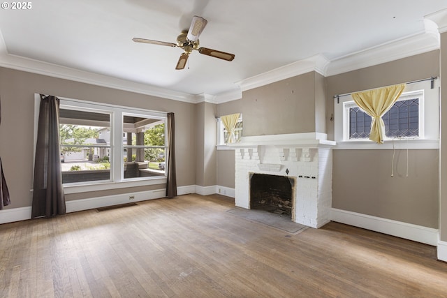 3003 SE 58th Ave, Portland, OR 97206 - unfurnished living room featuring crown molding, wood finished floors, a ceiling fan, and a brick fireplace