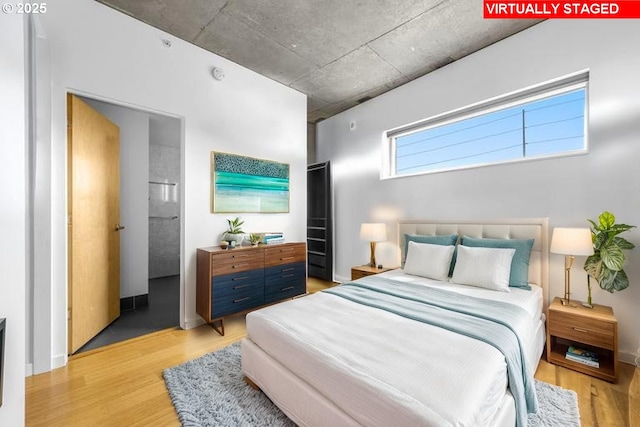 1234 SW 18th Ave Unit 305, Portland, OR 97205 - bedroom featuring light wood-style flooring and baseboards