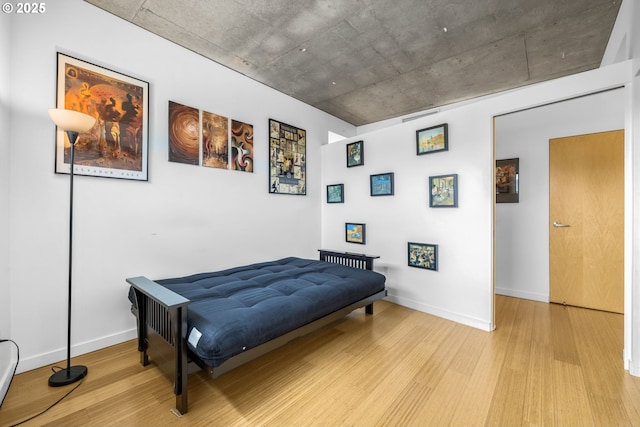 1234 SW 18th Ave Unit 305, Portland, OR 97205 - bedroom featuring light wood-type flooring and baseboards