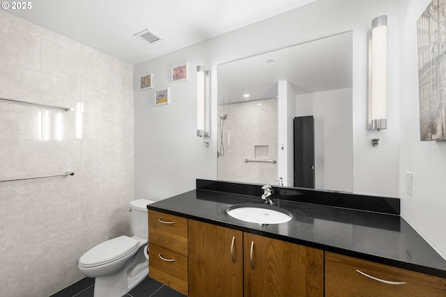 1234 SW 18th Ave Unit 305, Portland, OR 97205 - full bath featuring visible vents, toilet, vanity, and tile patterned floors