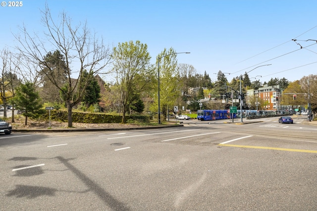 1234 SW 18th Ave Unit 305, Portland, OR 97205 - view of road with curbs, street lighting, sidewalks, and traffic lights