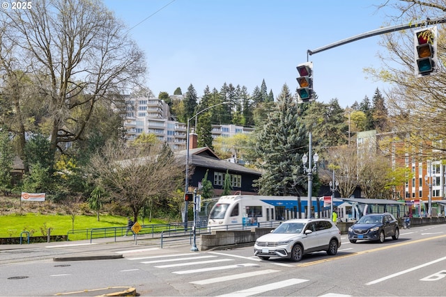 1234 SW 18th Ave Unit 305, Portland, OR 97205 - view of street with street lighting, traffic signs, curbs, traffic lights, and sidewalks