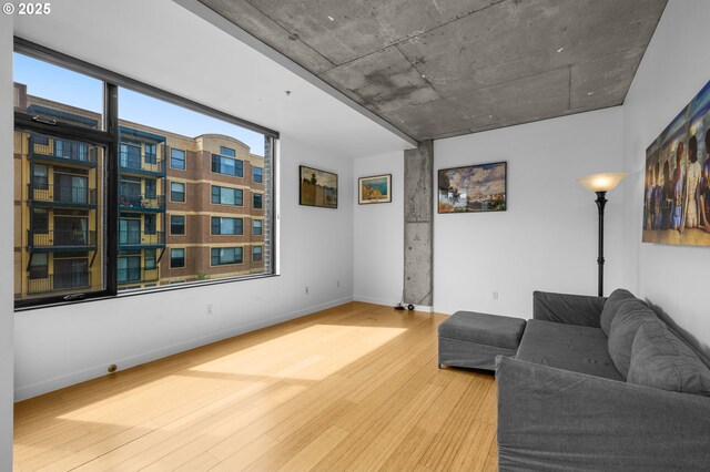 1234 SW 18th Ave Unit 305, Portland, OR 97205 - living area featuring wood finished floors and baseboards
