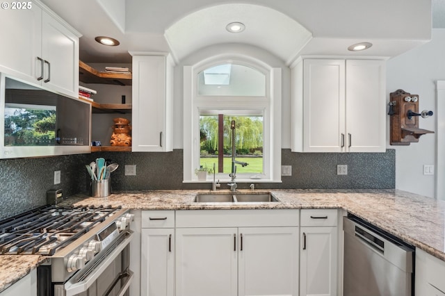 12875 Peggys Pl, Hubbard, OR 97032 - kitchen featuring a sink, appliances with stainless steel finishes, white cabinets, and open shelves