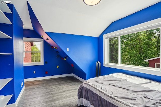 12875 Peggys Pl, Hubbard, OR 97032 - bedroom featuring baseboards, multiple windows, wood finished floors, and lofted ceiling