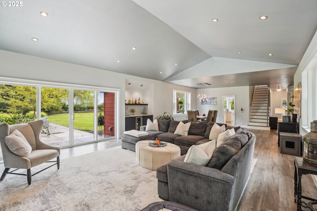 12875 Peggys Pl, Hubbard, OR 97032 - living area with recessed lighting, vaulted ceiling, stairs, and wood finished floors