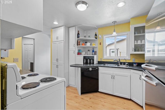 814 SW 44th St, Pendleton, OR 97801 - kitchen featuring black dishwasher, electric stove, dishwasher, dark countertops, and light wood-style floors