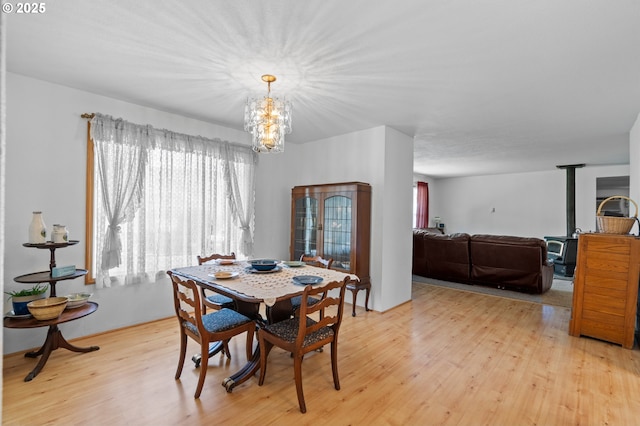 814 SW 44th St, Pendleton, OR 97801 - dining space with a chandelier, light wood-style floors, and healthy amount of natural light