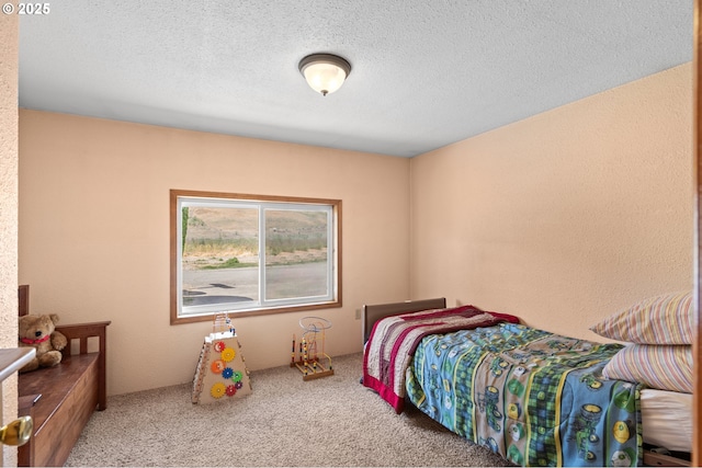 814 SW 44th St, Pendleton, OR 97801 - carpeted bedroom featuring a textured ceiling