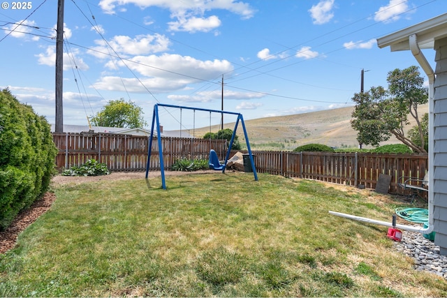 814 SW 44th St, Pendleton, OR 97801 - fenced backyard featuring a playground and a mountain view