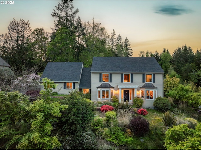 colonial inspired home featuring a standing seam roof and metal roof