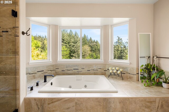 bathroom featuring a tub with jets