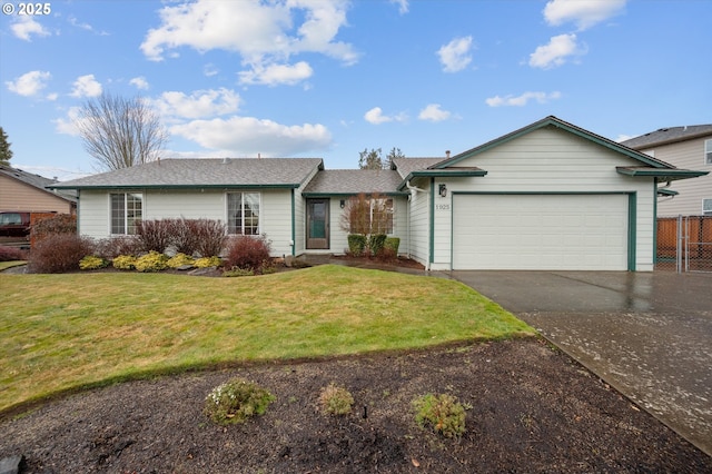 ranch-style house with a garage and a front yard