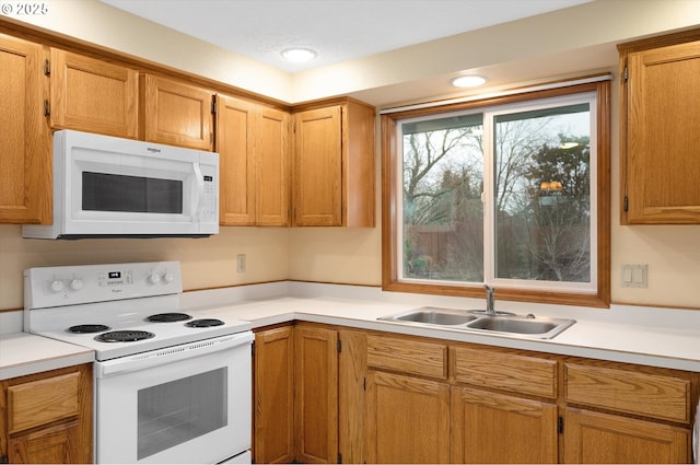 kitchen with sink and white appliances