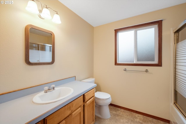 full bathroom with vanity, toilet, and combined bath / shower with glass door