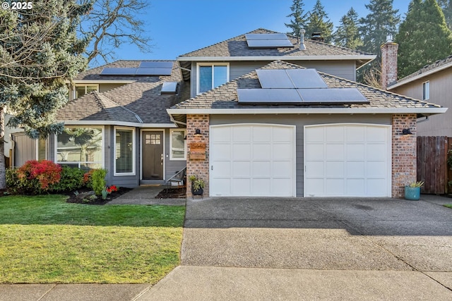 traditional-style home featuring a garage, brick siding, fence, driveway, and a front lawn