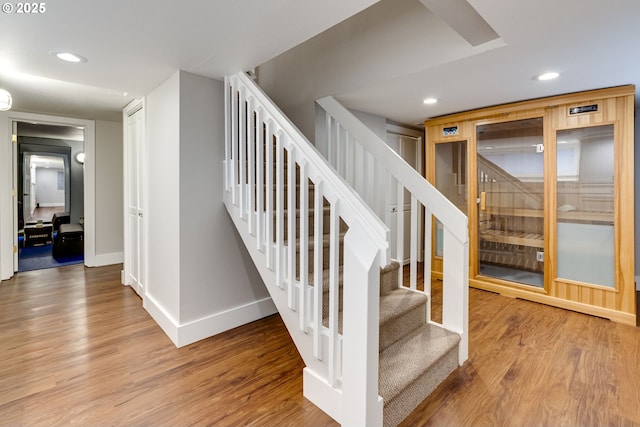 stairs featuring recessed lighting, baseboards, and wood finished floors