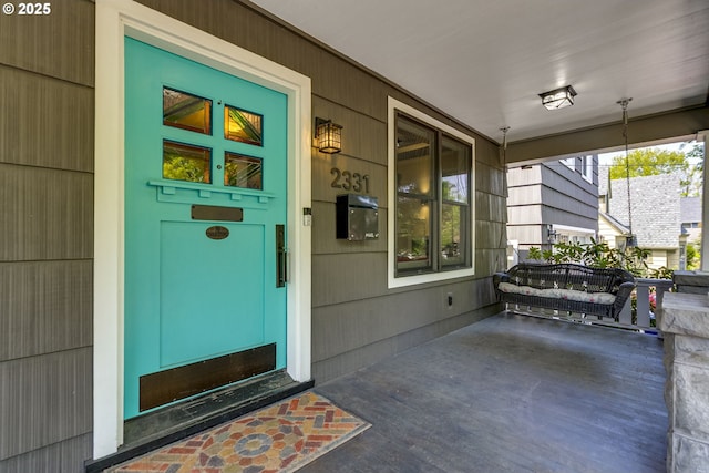 doorway to property with covered porch