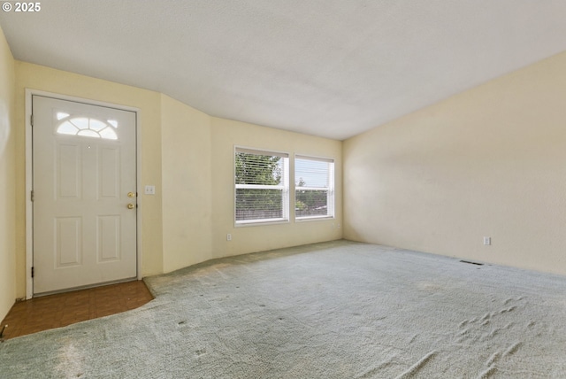 entryway with carpet flooring