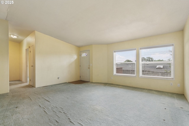 unfurnished room featuring carpet flooring