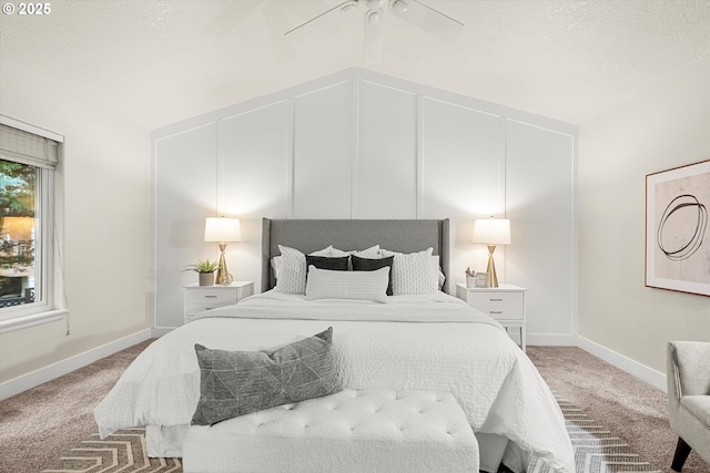 bedroom featuring ceiling fan, carpet floors, a textured ceiling, and vaulted ceiling