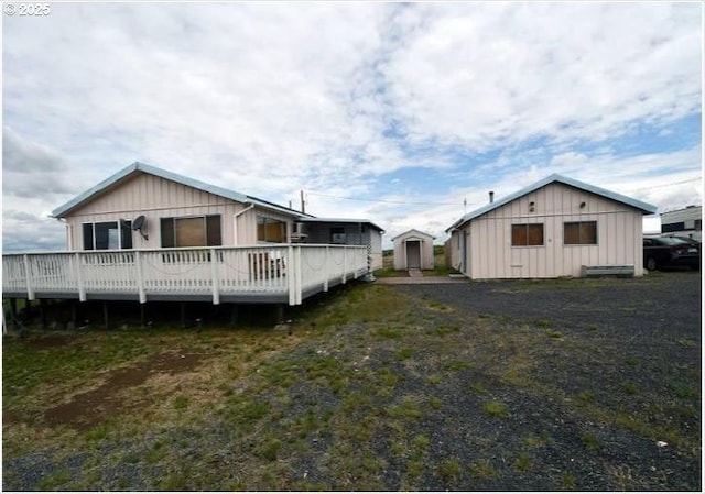 58474 Old Lake Rd, Christmas Valley, OR 97641 - back of property featuring a deck and board and batten siding
