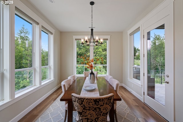 1825 NW Tanner Ct, Camas, WA 98607 - dining room featuring a chandelier, wood finished floors, and baseboards