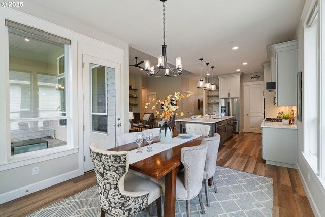 1825 NW Tanner Ct, Camas, WA 98607 - dining space with a chandelier, dark wood-style flooring, recessed lighting, and plenty of natural light