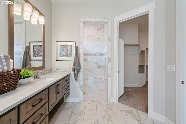 1825 NW Tanner Ct, Camas, WA 98607 - full bath featuring marble finish floors, vanity, a marble finish shower, baseboards, and a walk in closet